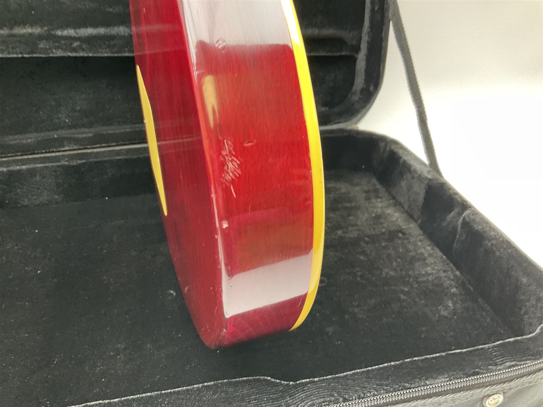 1980s Les Paul Epiphone limited edition cut-away electric guitar by Gibson, the burgundy coloured body with two pick-ups, volume and tone knobs and scratch plate, original tuning pegs, serial no.U6030215, 101cm overall; in modern Kinsman fitted carrying case