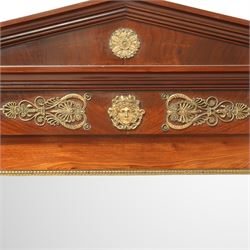 Rare pair of French Second-Empire neoclassical style mahogany mirrors with ormolu mounts, architectural pediment with central ormolu patera above flame mahogany frieze with honeysuckle flower and caryatid mounts, the frame with ormolu beading and bevelled mirror plates, flanked by turned columns with ormolu mounts above a reverse breakfront base, circa 1870