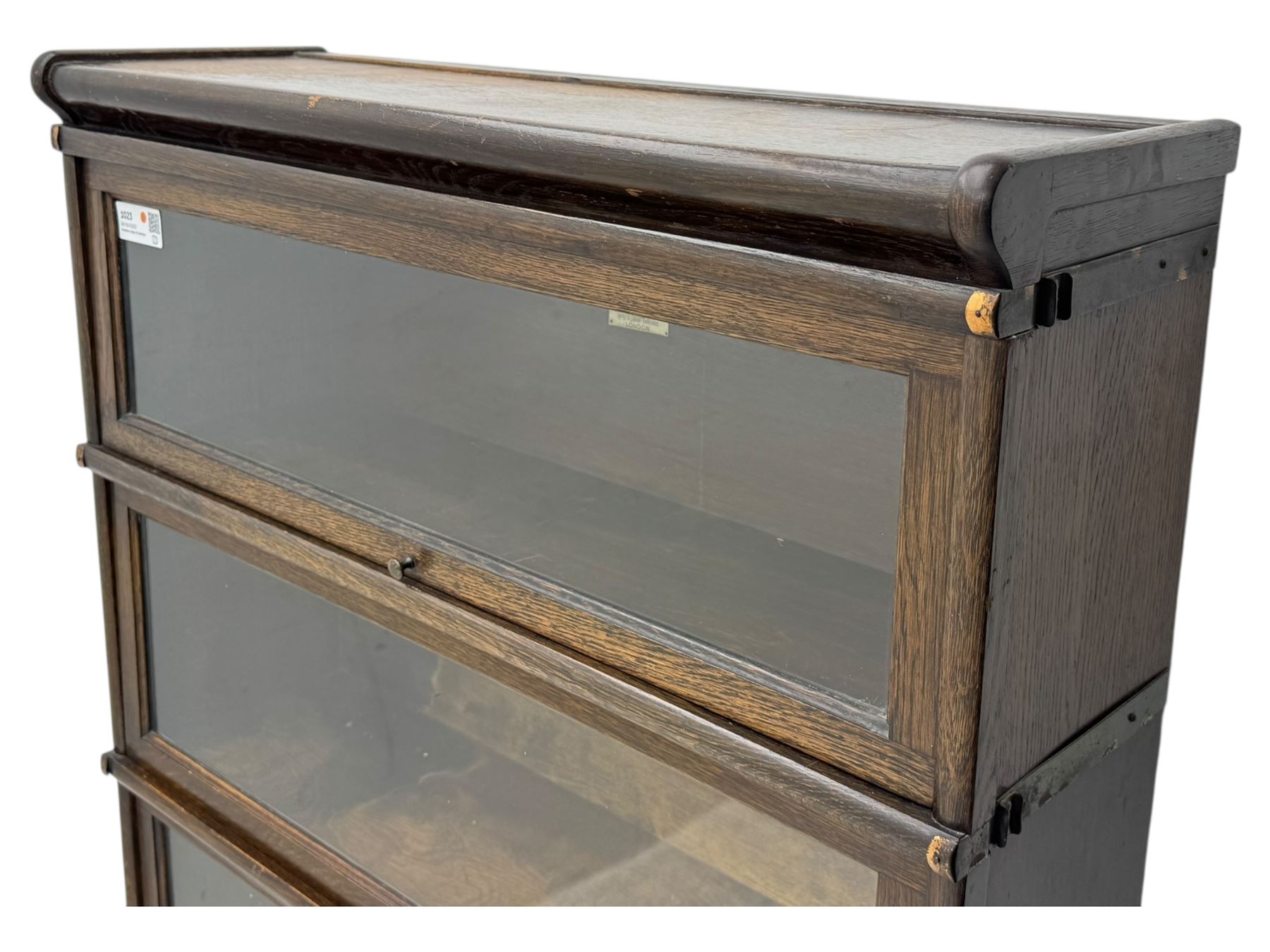 Globe Wernicke - stacking sectional library bookcase, over four glazed up-and-over doors, each bearing original makers mark, on moulded plinth base with inbuilt drawer