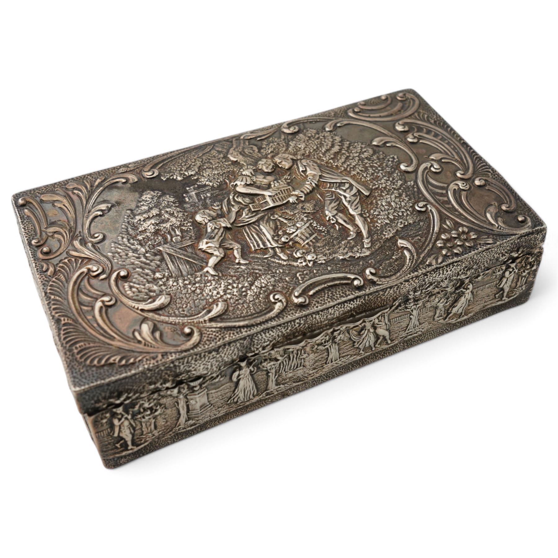 Late Victorian silver rectangular ring box embossed with classical figures, musicians, scrolls etc, and with plush lined divided interior L14.5cm Birmingham 1900 Maker Levi & Salaman