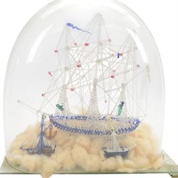 Victorian glass frigger of a three mast ship and a smaller ship under a glass dome, H38cm