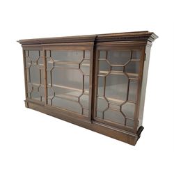 Early 20th century mahogany breakfront wall hanging bookcase, projecting dentil cornice over astragal glazed doors