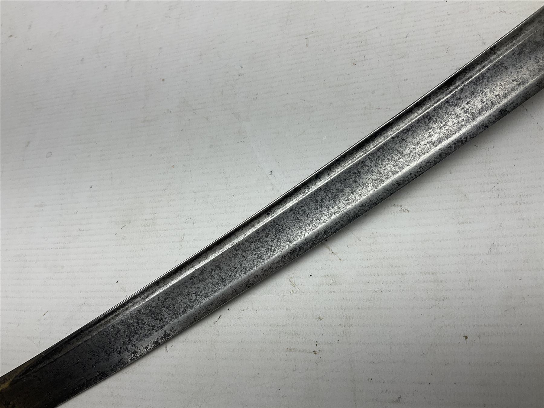 Late 18th century sword, the Spanish 79.5cm curving fullered blade engraved with the Royal Cypher, battle trophies and 'Viva Espania' banner, French Sabre de Mineur brass three-bar hilt with ebonised reeded grip L93.5cm overall (no scabbard)