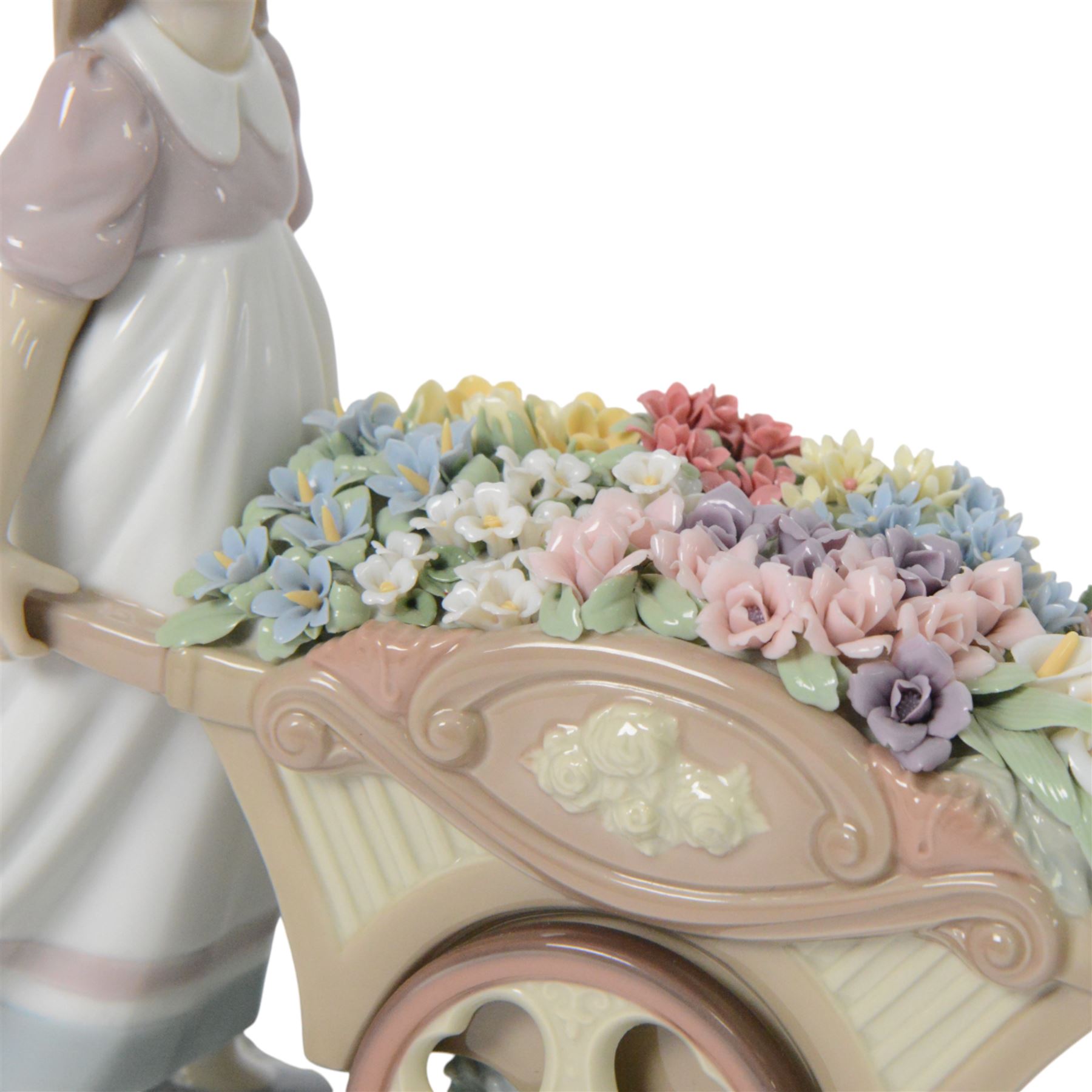 Lladro, Love's tender tokens girl, with floral filled wheelbarrow, model 6521, H23cm