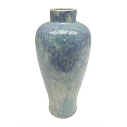 Holyrood Pottery vase of bulbous form decorated in a mottled and streaked green and blue glaze, with printed mark beneath, H24cm