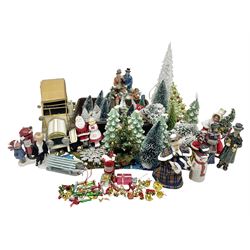 Collection of miniature dolls house Christmas figures and decorations, to include composite figure of family building snowman, postbox, Christmas trees and presents, together with a miniature metal car, etc