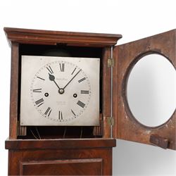 John Hill of Covent Garden, London- Slim Regency 8-day mahogany longcase clock c1820, plain case with a flat top and cornice, square door to the dial with a circular glazed aperture, rectangular trunk with a long door and moulding beneath, raised panel and applied skirting, silvered sheet dial with Roman numerals, spade hands and makers name, weight driven rack striking movement with a recoil anchor escapement, striking the hours on a bell. With weights and pendulum.
John Hill is recorded as working at Covent Garden for a relatively short period 1820-24.


