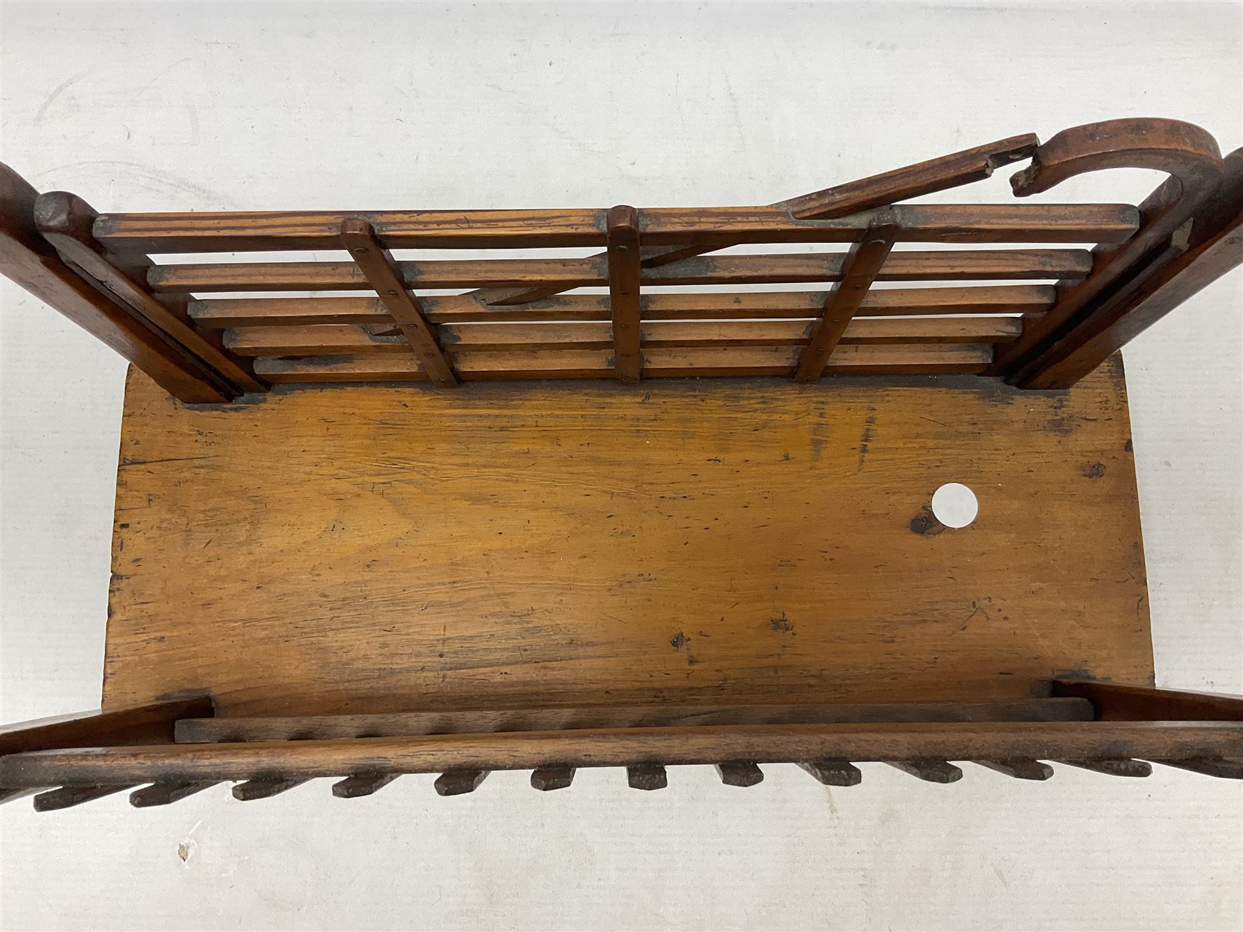 Early 20th century novelty letter rack modelled as a gate and picket fence, with brass post finials, on pine base, L43cm