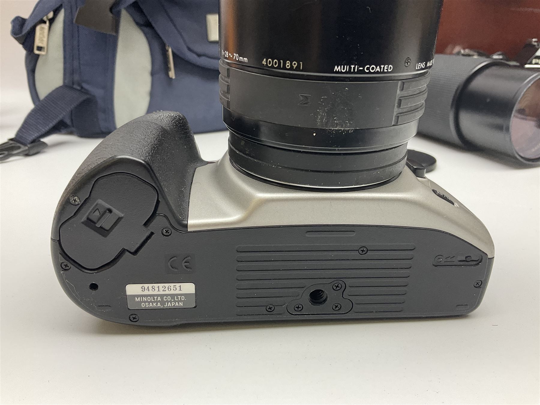 Four Minolta camera bodies, to include Dynax 500si, serial no. 94812651 with 'Signa Zoom 1;3.5-4.5 f=28-70mm' lens, Maxxum 300si, serial no. 97821665, with 'Tamron AF 80-210mm' lens and Dynax 300si, serial no 01603265'  with Minolta AF Power Zoom 35-80mm 1;4' lens, etc, together with Pantax MV1 camera bodies and other camera equipment 