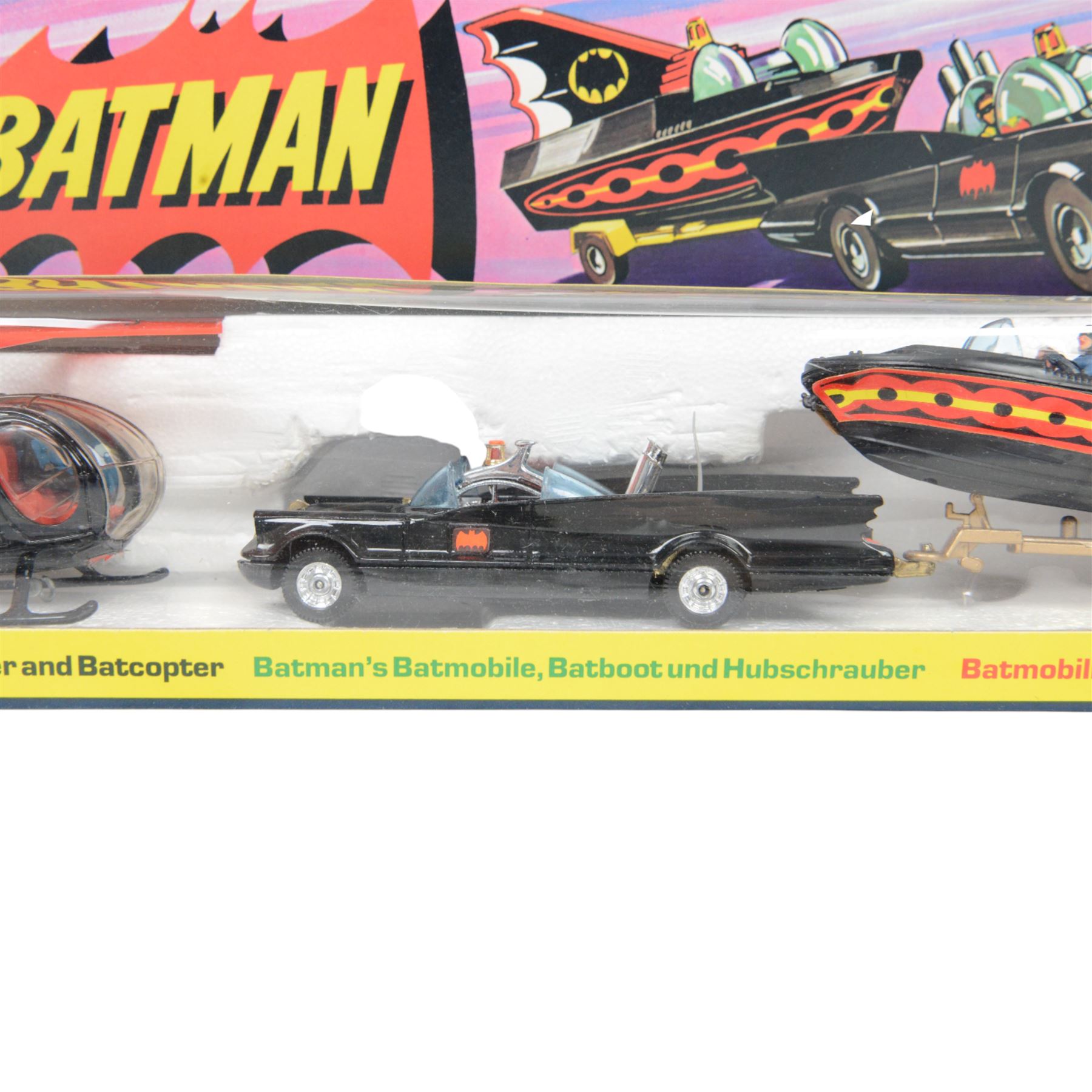 Corgi Batman Gift Set no. 40, comprising Batmobile, Batcopter, Batboat on trailer and twelve yellow plastic missiles on sprue, in original window box with pictorial header card and polystyrene interior, with outer cardboard protector