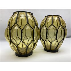 Pair of 20th century blown amber glass lanterns, the bodies of ovoid form with metal frames, H21cm
