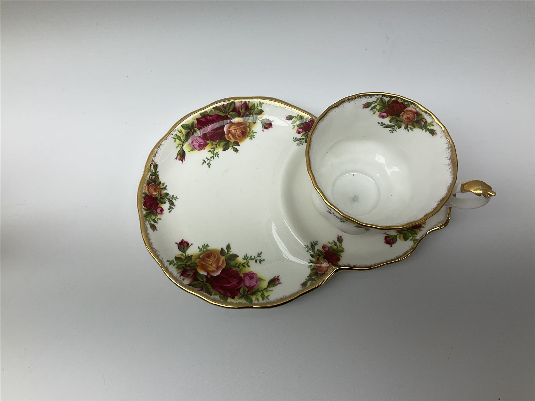 Royal Albert Old Country Roses pattern tea set, comprising teapot, coffee pot, six teacups and six saucers, five side plates, further teacup with joined saucer and side plate, open sucrier, milk jug, cake plate, and preserve pot and cover, together with Royal Albert Jubilee Rose pattern sauce boat and stand, and Royal Albert Lavender Rose pattern cake stand. 