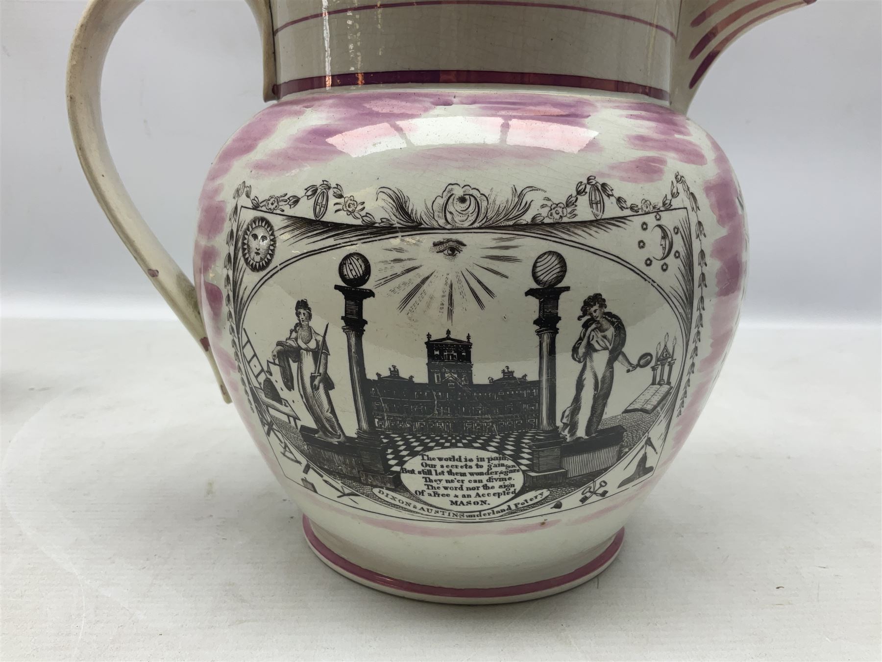 Early 20th century Sunderland lustre jug, decorated with transfer Masonic scene and poem 'The World is in Pain/Our Secrets to Gain/But Still Let Them Wonder and Gaze/The Never Can Divine/The World Nor The Sign/Of a Free and Accepted Mason', the reverse decorated with Sunderland River Wear cast iron bridge scene below text (a/f), together with a copper lustre jug, and pink lustre bowl, jug H20cm