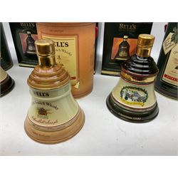 Six Bell's Old Scotch Whisky ceramic decanters comprising Old Scotch Whisky decanter, Christmas decanters 1990, 1991, 1993, 1994 and 1995, all in original boxes and decanter seals intact 
