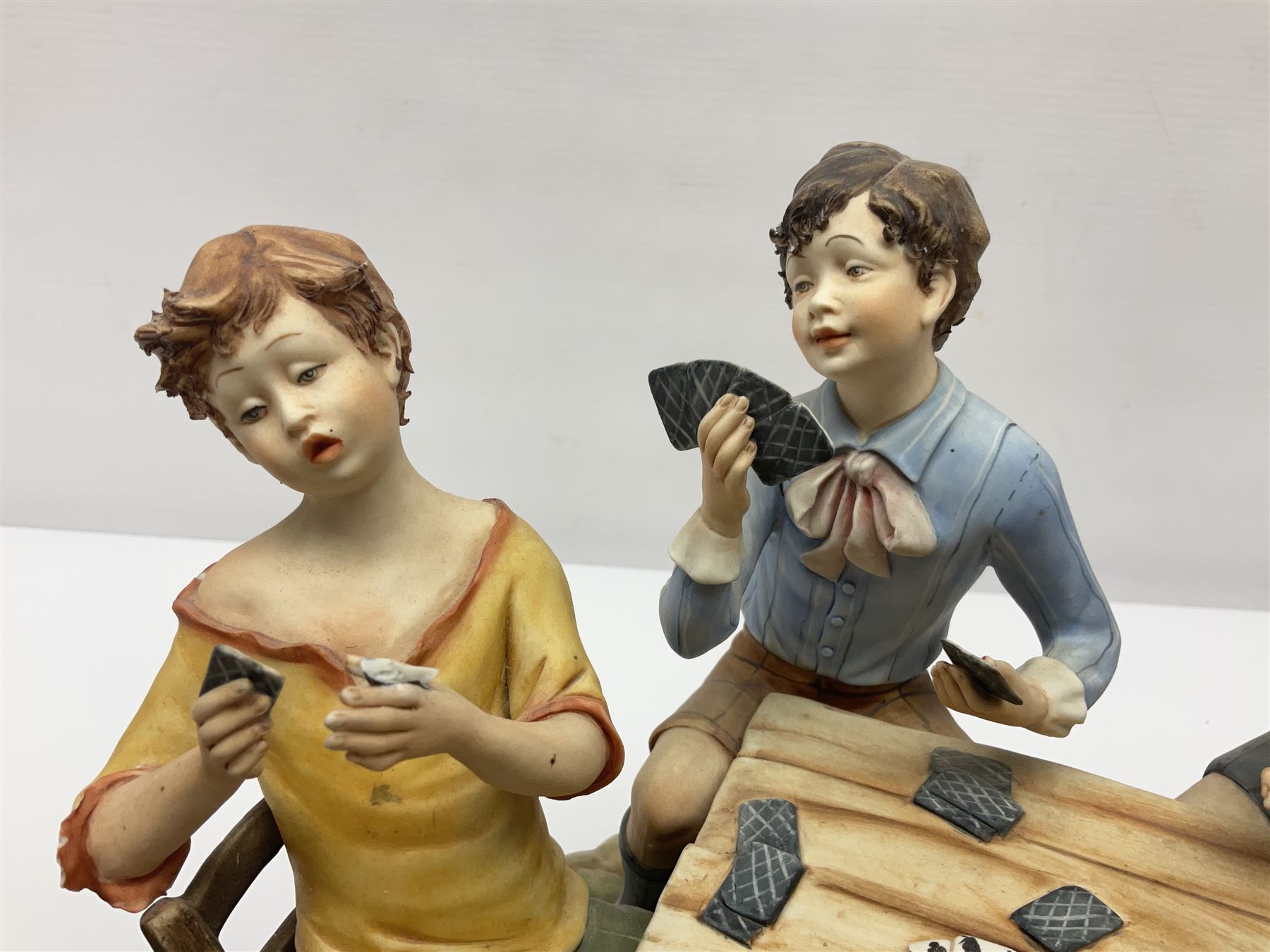 Capodimonte The Cheats, signed Zanella, together with another Capodimonte figure, H24cm  