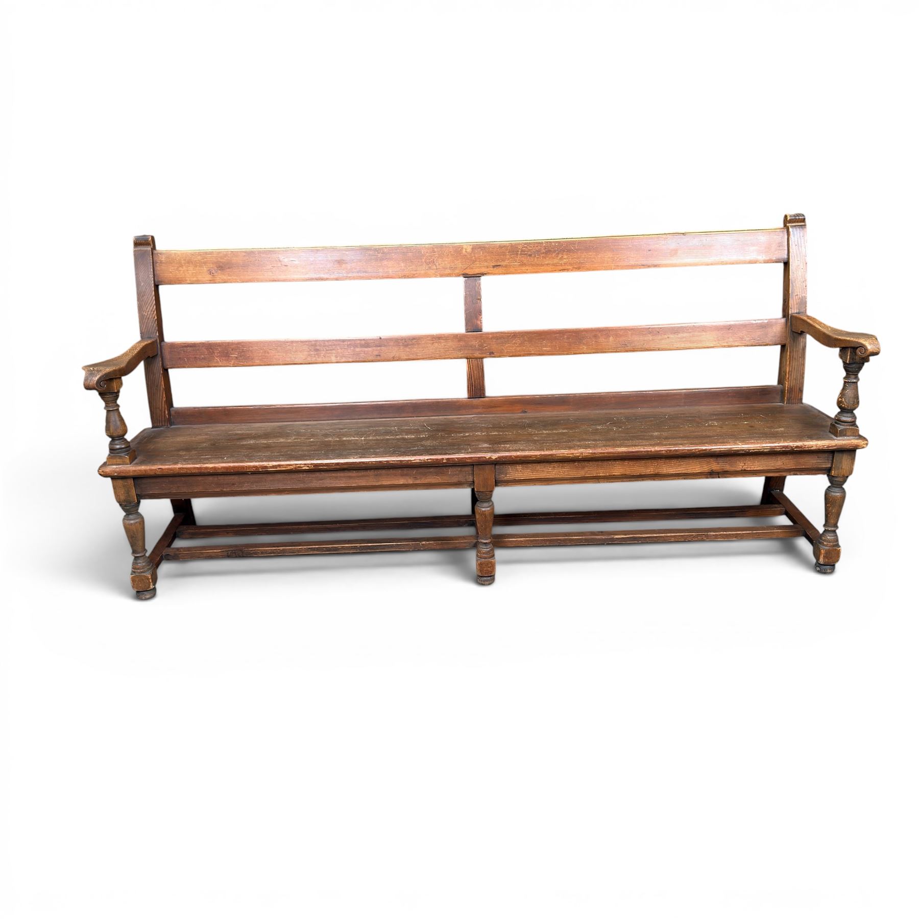 Early 20th century pine and oak bench seat, stained pine rail back frame with shaped oak arms
