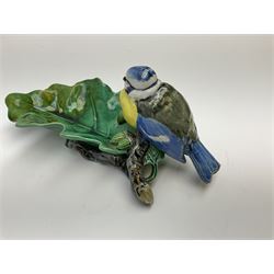 Minton majolica leaf dish, modelled as a Blue Tit perched on a branch with acorns and an oak leaf, date cypher for 1868, impressed marks beneath, L21cm. 