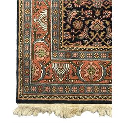 Persian Herati indigo ground rug, the field decorated with repeating Herati motifs, floral design border within guard stripes 