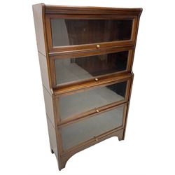 Kenric Efferson - early 20th century mahogany four-tier library bookcase, enclosed by four glazed up-and-over doors, on bracket feet