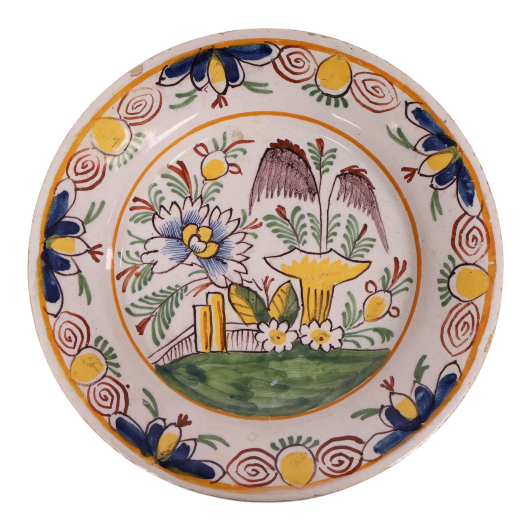 18th century Delft polychrome charger, decorated with a central landscape within a stylised floral boarder, D24cm 