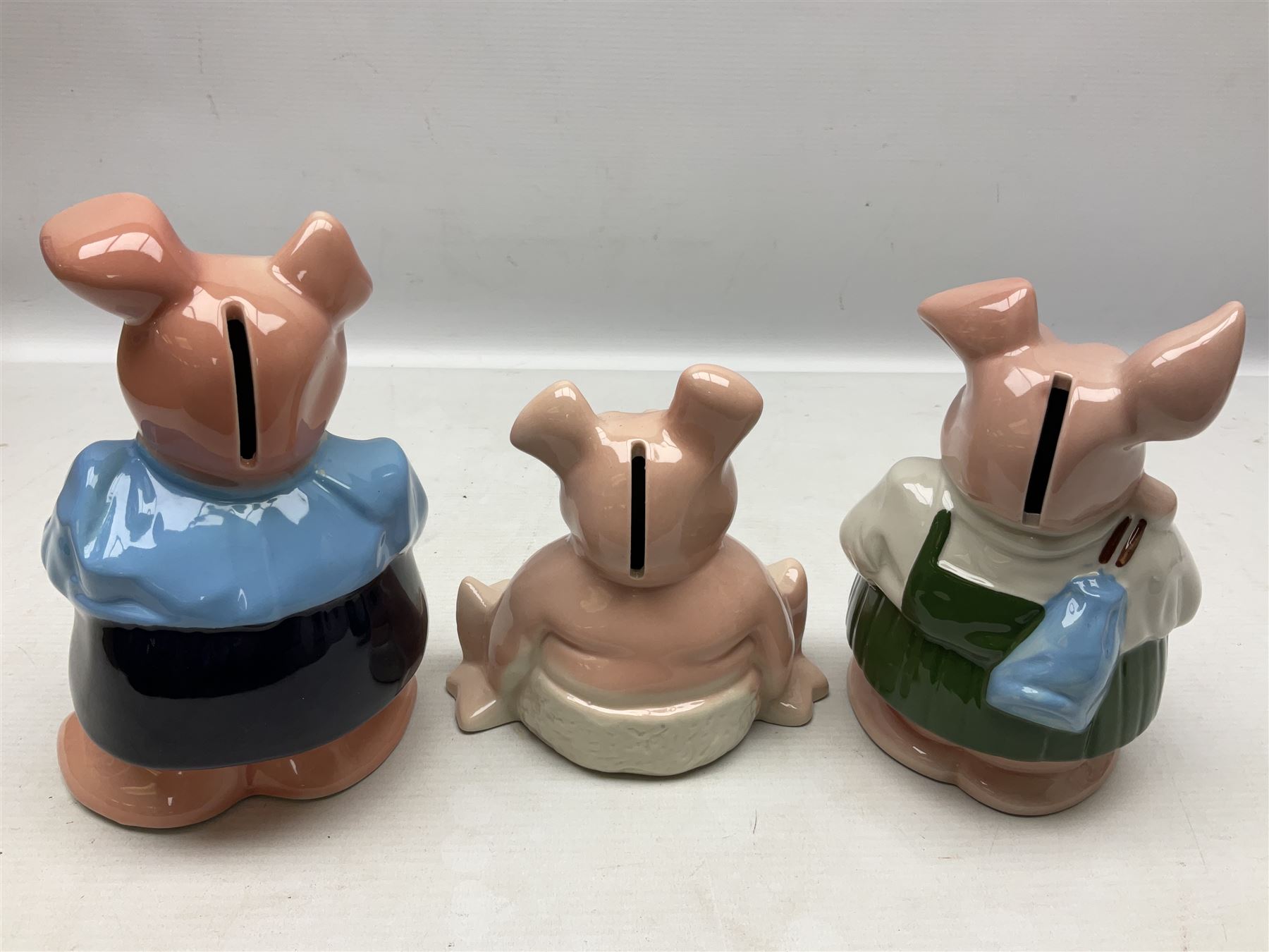 Set of five Wade NatWest money boxes, comprising father, mother, boy, girl and baby, four with original boxes 