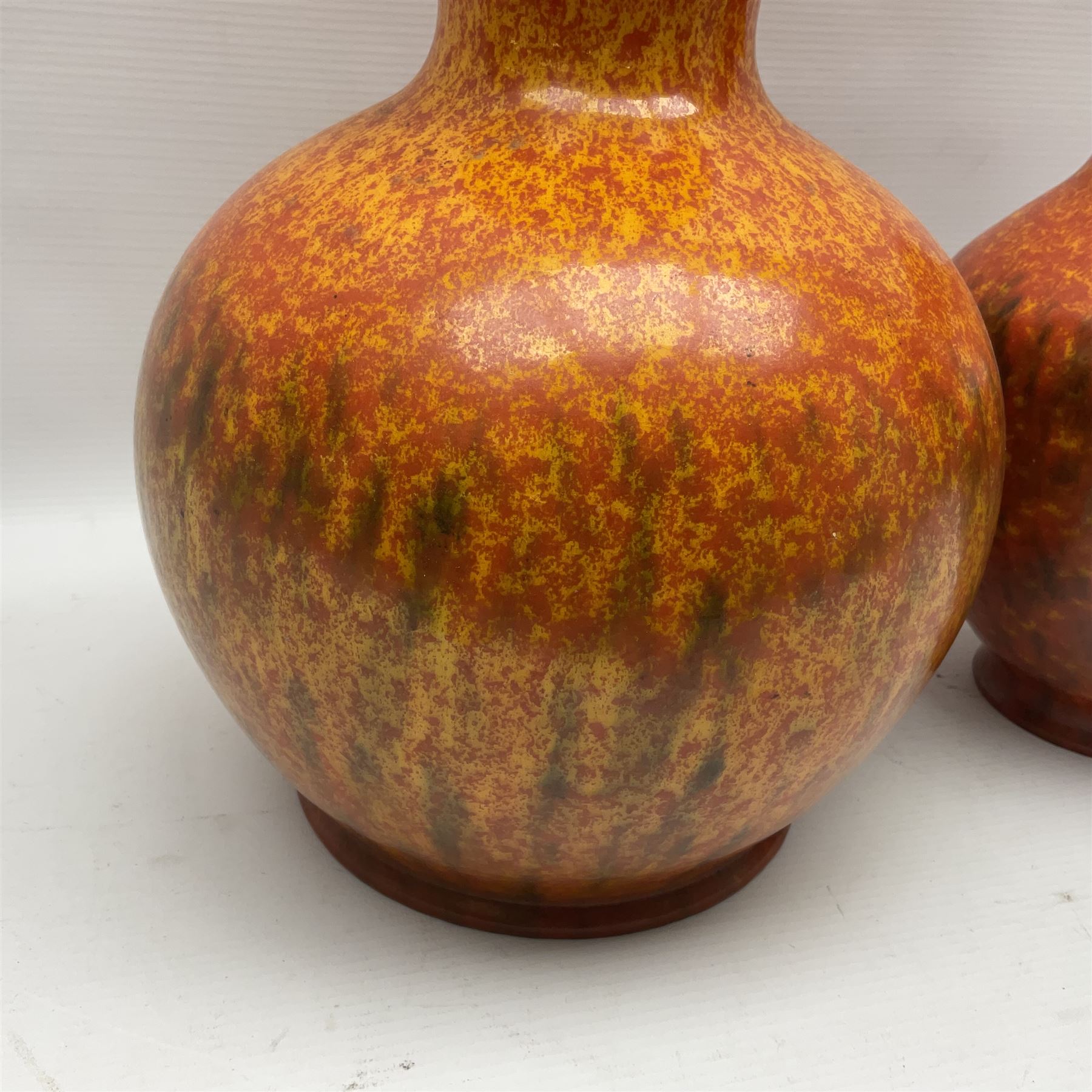 Two Pilkington's Royal Lancastrian vases of baluster form decorated in orange Vermillion, larges H27cm