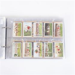 Collection of Edwardian and later Football related trading and cigarette cards, including forty-nine of fifty 1906 Ogden's Football Club Colours, 1922 PALS Footall series, ninety of one hundred 1925 Gallaher Famous Footballers, complete set of forty-four 1926 Ogden's Captains of Association Football Clubs and Colours, complete set of fifty 1927 Players Football Caricatures by MAC,  complete set of fifty 1927 Players Football Caricatures by RIP,  complete set of fifty 1930 Players Association Cup Winners, complete set of 50 1933 Ogdens AFC Nicknames etc, housed in brown cigarette card album