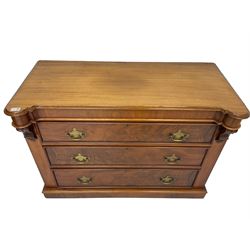 Victorian mahogany chest, shaped and moulded top over three drawers, the uprights with carved corbel mounts, on plinth base 