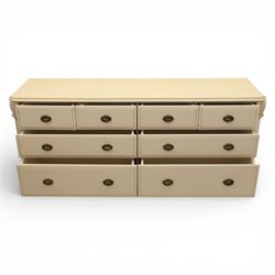 Contemporary French design white painted bedroom suite retailed by Barkers of Northallerton, comprising wide chest fitted with four short and four long drawers with oval brass handles (H 70cm, W 159cm, D 46cm), pair of bedside chests each fitted with three drawers (H 62cm, W 40cm, D 46cm), dressing table fitted with four short drawers and central kneehole with shaped apron (H 79cm, W 131cm, D 46cm) with matching framed wall mounted mirror (H 100cm, W 113cm), and full length standing mirror (H 175cm, W 73cm)