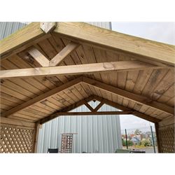 Large wood slatted garden seat with canopy, lattice sides