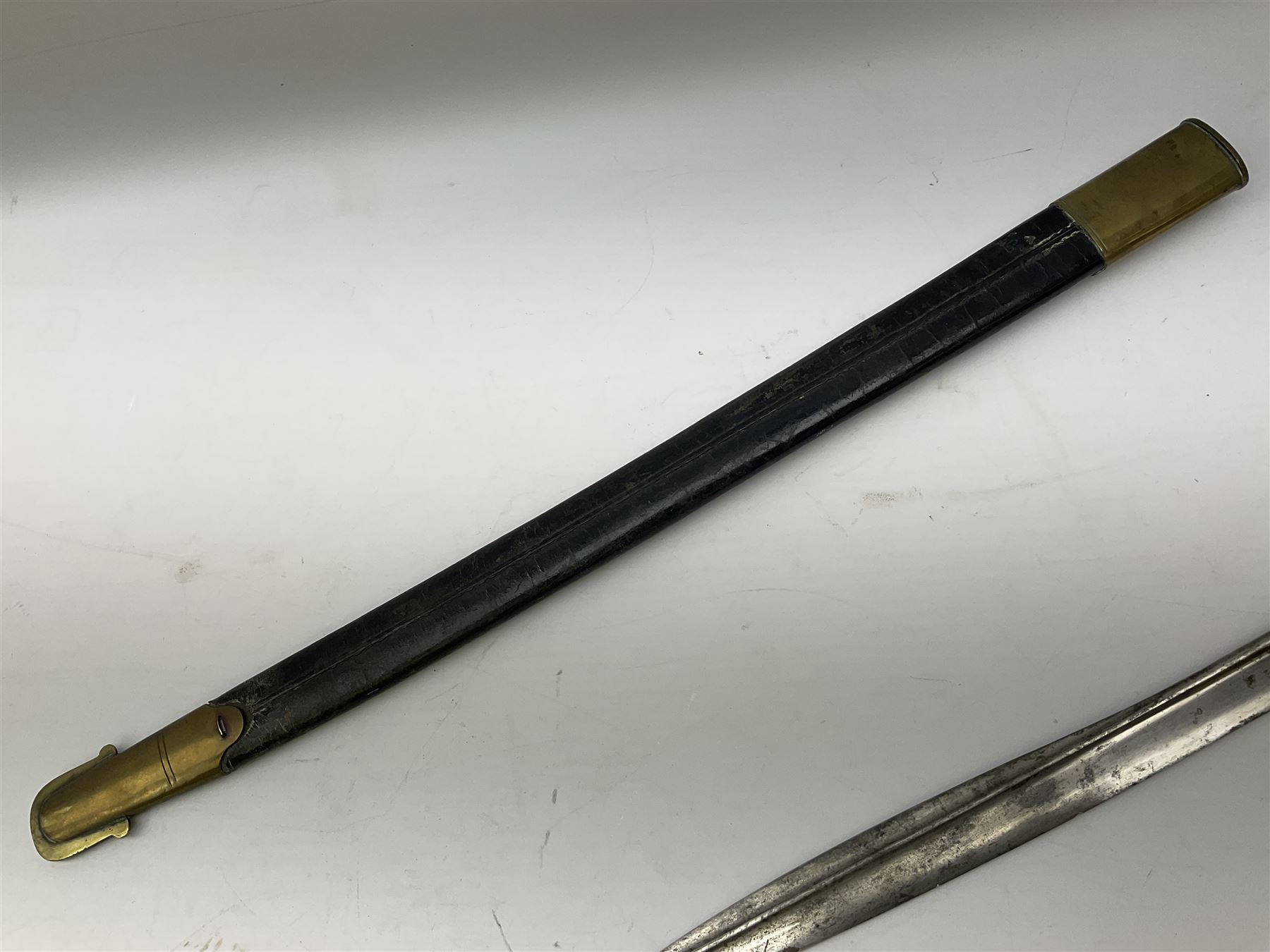 British 1855 pattern 'Sappers & Miners' Lancaster sword bayonet as issued to Medical Corps, the 62cm steel blade marked S&K with various numbers; in brass mounted leather scabbard numbered 1176