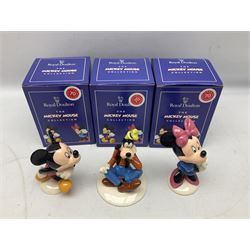 Three Royal Doulton The Mickey Mouse Collection figurines comprising Mickey Mouse MM1, Minnie Mouse MM2, and Goofy MM5, together withe three Royal Doulton limited edition miniature snowman character jugs comprising Christmas Stocking Snowman D7124, Christmas Cracker Snowman D7158 and Snowman D7062, all with original boxes 