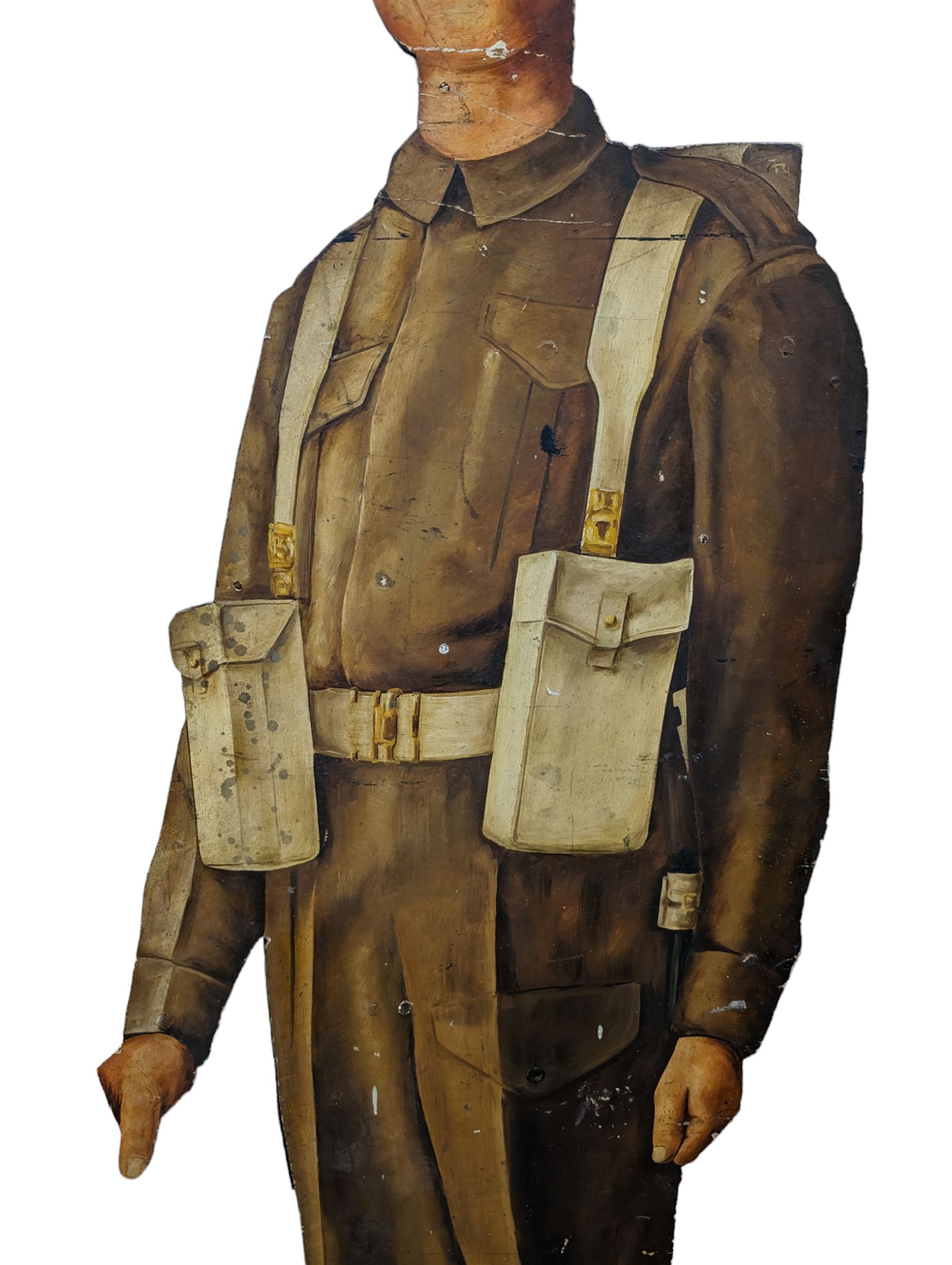 Military Outfitters hand painted life size wooden cut out figure of a WW1 soldier standing at ease holding a gun by his side, marked Stening Signs; hardboard on planked frame H199cm