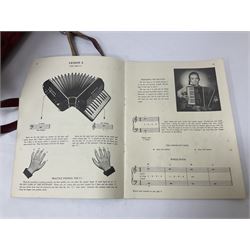 German Hohner student II compact accordion with 26 keys and 12 bass registers in a hard case With tutor