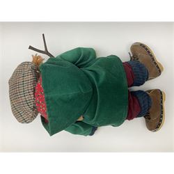 Lakeland Bears teddy bear, titled 'Walkright', dressed as a hiker in green corduroy duffle coat over fair isle jumper, trousers and knit socks, complete with leather clogs with wood soles, walkers thumb stick, knitted scarf, flat cap and rucksack housing original tag and map, H50cm