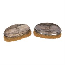 Collection of silver, including pair of silver mounted clothes brushes, cigarette case, mustard pot, pepper shaker, glass jar with silver lid and oval box