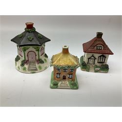 Group of Victorian Staffordshire, and later Staffordshire style buildings, some pastille burners, one example a money box. 