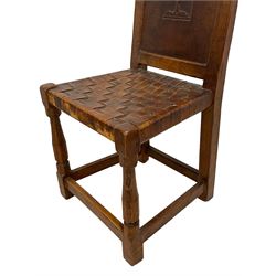 Mouseman - circa. 1930s set of six (4+2) oak dining chairs, panelled back carved with the Bagshawe family crest, the moto 'Forma Flos Fama Flatus' over an arm grasping a bugle-horn with ribbon tie and Yorkshire rose motif, adzed frame, leather lattice strap seat, on octagonal supports united by stretchers, two carvers and four side chairs, each carved with mouse signature, by Robert Thompson of Kilburn 

Provenance: Owned since manufacture by the Bagshawe family, descendants of the Staithes Group Artist Joseph Richard Bagshawe RBA (1870-1909).