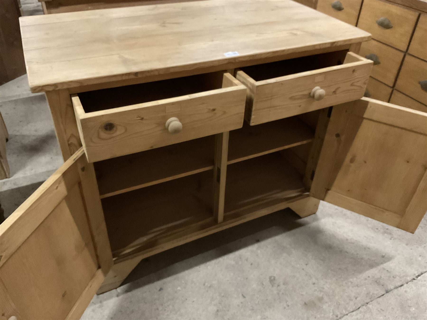 Traditional pine cupboard, fitted with two drawers over two panelled cupboards  - THIS LOT IS TO BE COLLECTED BY APPOINTMENT FROM THE OLD BUFFER DEPOT, MELBOURNE PLACE, SOWERBY, THIRSK, YO7 1QY