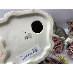 Two Royal Doulton cats, two Capodimonte style figures, and four ceramic baskets of flowers 