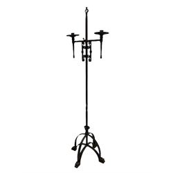 Ironwork candle holder stand, with stamped decoration, adjustable two branch sconces with scrolled iron work, twist stem with arched supports with scrolled terminals