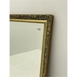Rectangular bevelled mirror in gilt frame (112cm x 87cm), and a narrow bevelled mirror (2)