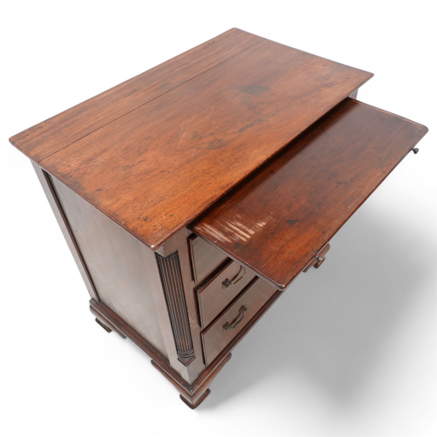 Georgian mahogany bachelor's chest, brushing slide over three long drawers, enclosed by canted corners with fluted quarter columns, on ogee bracket feet