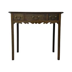 18th century oak lowboy, rectangular moulded top over three frieze drawers with brass swing handles, scalloped apron, on slender square section supports