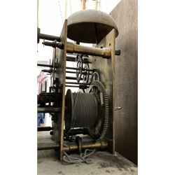 8-day oak longcase clock - in an early 18th century styled case with a caddy top, square hood door with barley twist columns, long carved trunk door on a conforming plinth with an applied skirting base, square brass dial with an engraved centre, silvered chapter and spandrels, 19th century rack striking movement, striking the hours on a bell. With weights and pendulum.