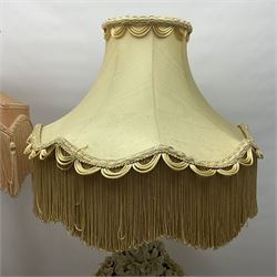 Two Casa Pupo style white glazed table lamps, the first example modelled as a fountain overflowing with flowers, the second with cascading leaves and flowers, both upon gilded wooden bases with fabric tassel shades, H80cm