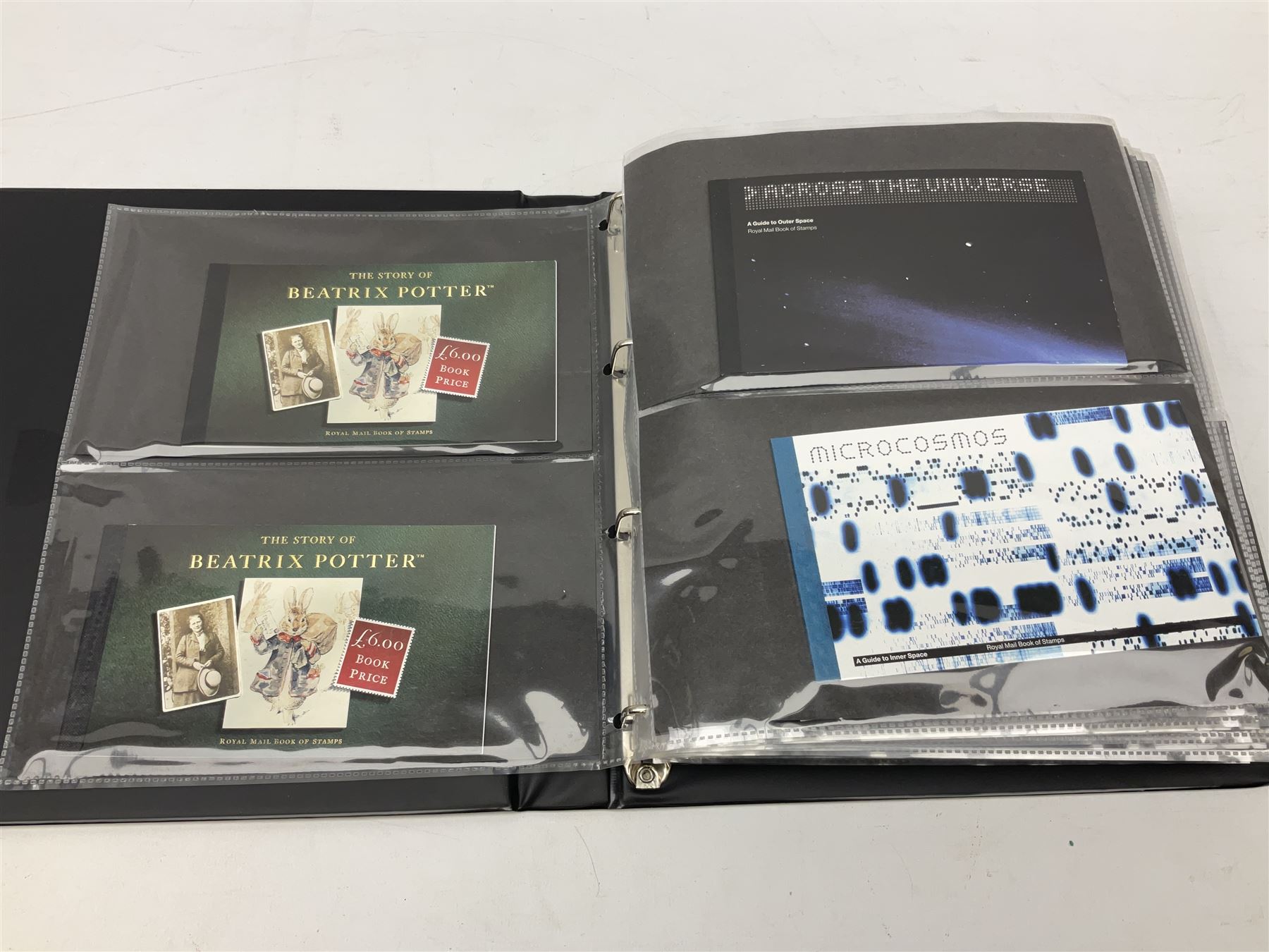 Seventy-five Royal Mail book of stamps, including 'The Story of Beatrix Potter', 'Microcosmos', 'Across The Universe', 'A Perfect Coronation', 'The Bronte Sisters', 'Battle of Trafalgar Death of Nelson' etc, housed in a ring binder album