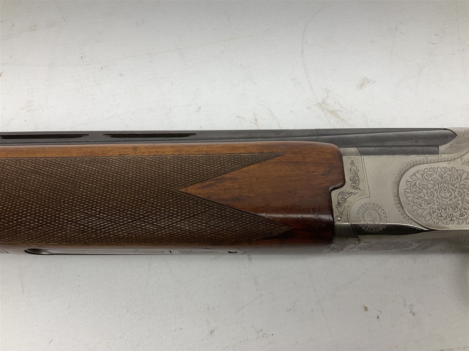 Winchester Japan 5500 12-bore by two-and-three quarters over-and-under double barrel boxlock ejector sporting gun, with 71cm barrels, ventilated rib and barrels, the walnut stock with chequered pistol grip and fore-end, single selective trigger and top safety, serial no.K542927E, L115cm overall; in gun sling SHOTGUN CERTIFICATE REQUIRED