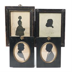 Pair of early 20th century oval male and female silhouette portraits, one indistinctly sig...