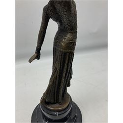 After Demetre Chiparus (1886-1947), an Art Deco style bronze, modelled as a female figure, signed and with foundry mark, raised upon a circular stepped base, overall H37.5cm.